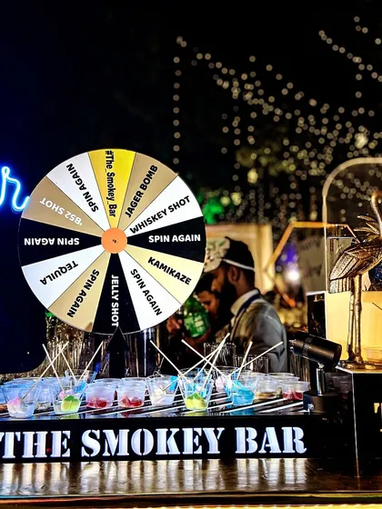 I believe a bar should be interactive and fun. Here's my custom shot wheel in action, a fantastic icebreaker that gets guests mingling and trying a variety of shots like Jager Bombs, Kamikaze, and Tequila. It’s a guaranteed way to get the party started.