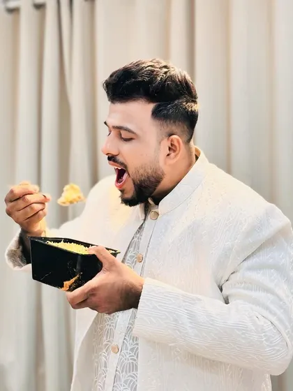 This is the expression of pure joy when you take the first bite of our White Biryani. We love seeing our customers, dressed for an occasion, enjoying our food at home.