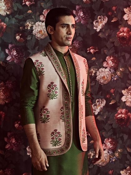 A detailed look at the hand-block printed jacket, showcasing the fine border and elegant floral motifs of this traditional Rajasthani craft.