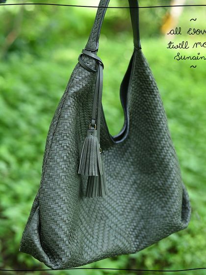 The Sunaina hobo bag in our All Woven Twill Moss edit. This beautiful olive green leather is completely hand-woven, creating a soft, slouchy, and incredibly lightweight bag that's perfect for everyday use.
