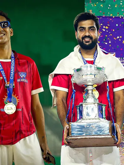 Two of our champions proudly holding the trophy.
