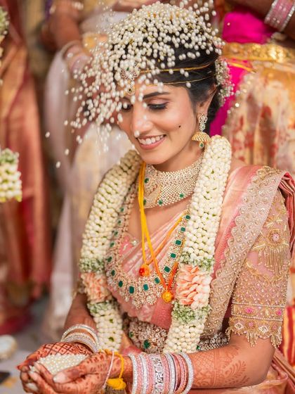 Bride Rishitha during her wedding rituals. The drape is designed to be comfortable even while seated, with the pleats and pallu remaining perfectly in place.