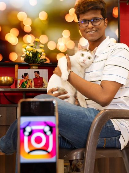 In this shot from the 'social media detox' series, the subject has put down the book and is now happily interacting with his cat, showing the joy of real-world connections.