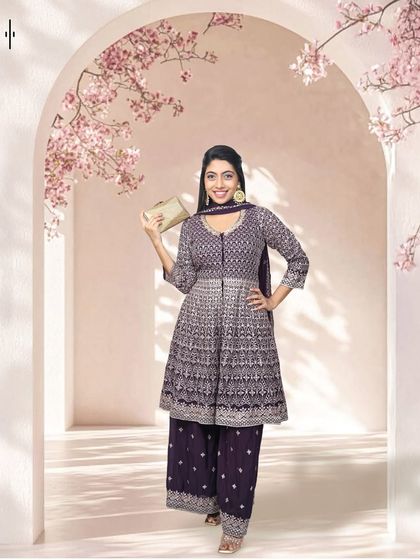 An elegant and versatile sharara set in a deep purple. The intricate white embroidery on the kurti makes it look so rich and festive. It's a great rental option for when you want to be comfortable without sacrificing style.