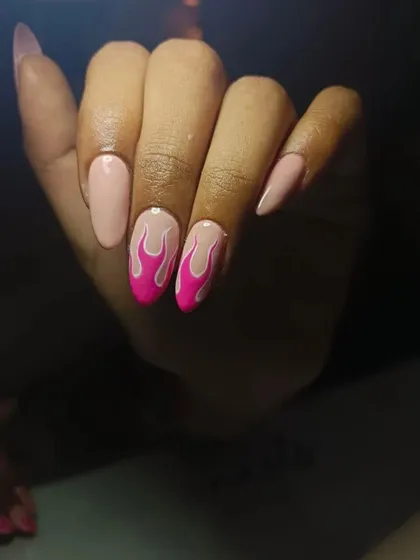 These nails are on fire. I hand-painted these pink flames on a nude base for a look that matches the rising summer temperatures.