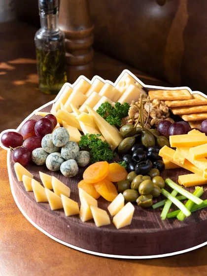 A beautiful cheese board is the perfect way to start a meal or enjoy with a glass of wine. I offer a selection of fine cheeses, fruits, nuts, and crackers.