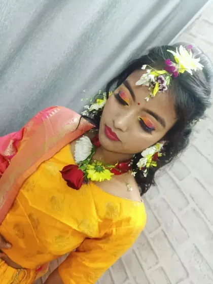 This image shows the student's complete vision for a modern Haldi look, combining traditional elements like fresh flowers with contemporary makeup techniques.