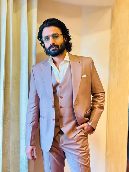 A close-up of Deepak Parambol's reception look. The focus was on a clean, sophisticated style that highlighted his features.