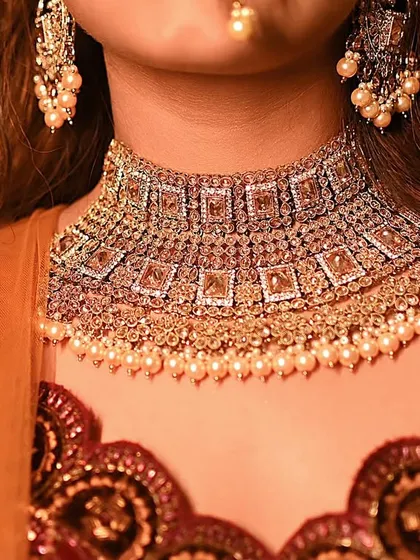 A detailed shot of a stunning bridal choker. The focus is entirely on the intricate design and craftsmanship of the jewelry, making it a perfect image for a product catalogue or a close-up feature on social media.