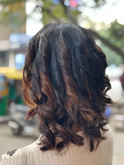 Beautifully crafted curls on display. This is the result of a hairstyling practical by our junior batch, showcasing their growing skills.