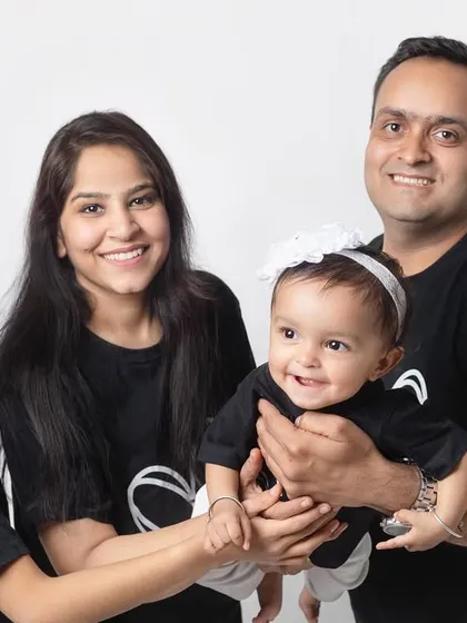 A happy family of four. I love capturing families as they grow, from one child to the next. The matching shirts are a lovely touch.