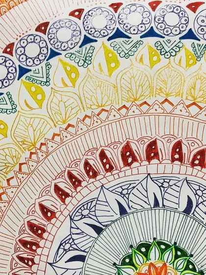 Mandala art is a wonderful way to improve focus and create something beautiful from simple patterns. This colorful piece, with its intricate details and vibrant inks, was created by one of my talented online students.