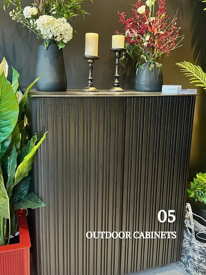 Outdoor cabinets are a stylish solution for storage. This elegant, fluted cabinet can hide away gardening tools, cushions, or barbecue essentials, keeping your terrace tidy and clutter-free.
