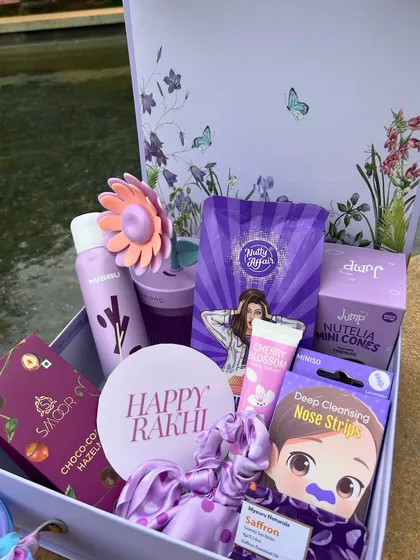 This purple-themed "Happy Rakhi" box is curated with a variety of self-care products, snacks, and accessories. Creating themed collections is a skill I teach in my workshop.