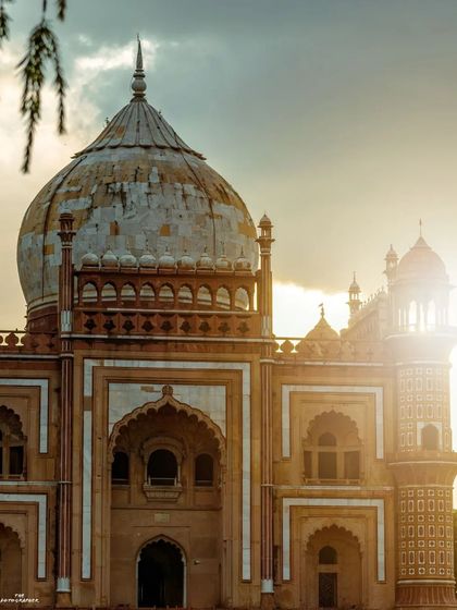 Capturing Safdarjung Tomb as the sun sets. The golden light catching the side of the dome brings out the warm colors of the stone and adds a beautiful glow to this historical landmark.