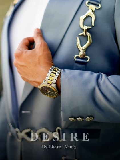 A focus on the custom hardware. This shot highlights the unique gold-tone chain-link clasps I used on the light blue satin blazer, adding a touch of bespoke luxury.