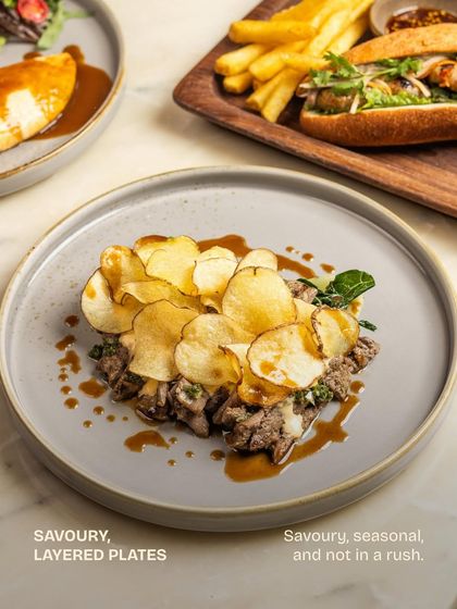 A layered plate of savory goodness, showcasing the textures and flavors that define our approach to brunch cooking.