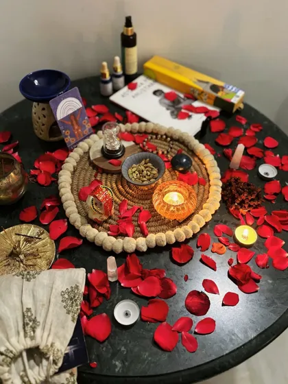The altar for our "Women & the Moon" workshop, adorned with rose petals, crystals, and oracle cards to honor the sacred feminine energy.