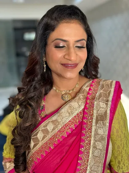 A close-up of her makeup, showing the soft shimmer on her eyes.