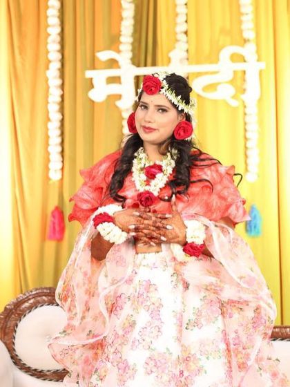 My beautiful bride Harshi, looking stunning with floral jewelry for her mehndi ceremony.