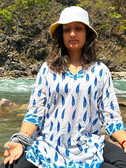 Finding a moment of quiet meditation by the flowing river in Rishikesh. These are the times during a retreat where you can truly pause, listen to the sounds of nature, and connect with your inner self.