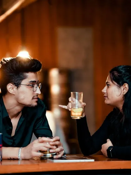 A couple enjoying a drink and the atmosphere at Ozone. My sets are not just for dancing; they create the perfect backdrop for a great night out.