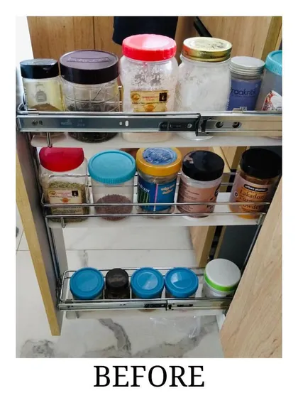 Before: A messy and disorganized pull-out spice rack with inconsistent containers, making it difficult to find what's needed.