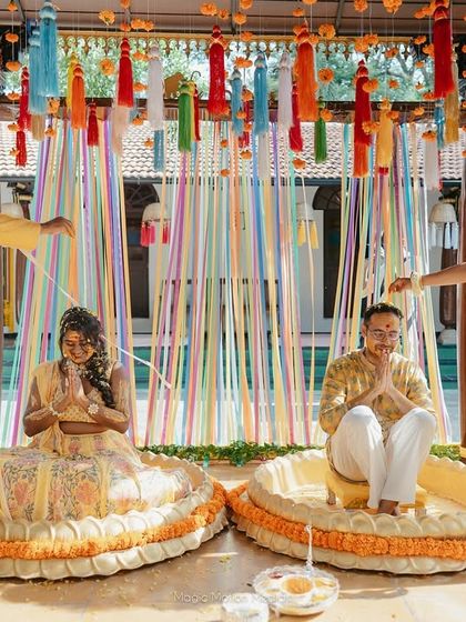 The Haldi ceremony setup, with colorful ribbons and traditional seating, ready for the festivities to begin.