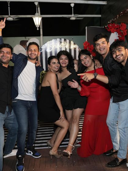 The bride's crew, full of smiles and energy, posing for a group photo.