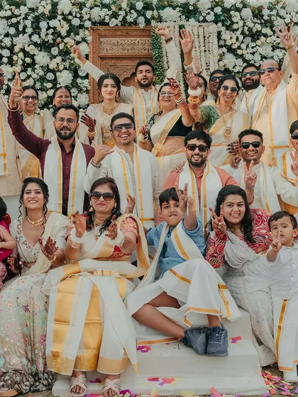 A beautiful family portrait from a South Indian Haldi, with everyone dressed in traditional attire. These are the pictures that will be cherished for generations.