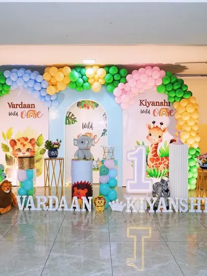 I designed this vibrant jungle theme for a set of twins, showing how I can create a large, cohesive look for any celebration. The setup includes personalized backdrops for each child and plenty of friendly animal cutouts.