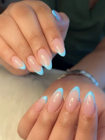 A beautifully posed shot of the baby blue French manicure, perfect for your inspiration board.