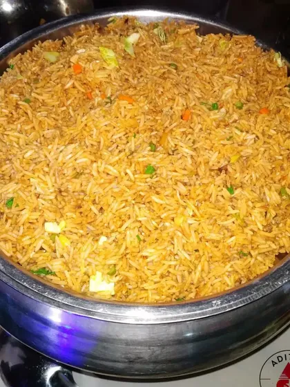 Our Vegetable Fried Rice is a simple yet delicious option that complements any Indo-Chinese main course. It's lightly seasoned and tossed with a mix of finely chopped carrots, beans, and cabbage.