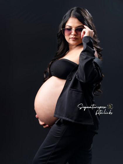 The boss-mom look. This portrait with sunglasses and a blazer is effortlessly cool and confident.