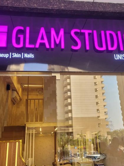 Another view of our salon entrance, showcasing the modern, multi-level interior through the glass doors. We are proud to offer a premium salon experience in a convenient location.