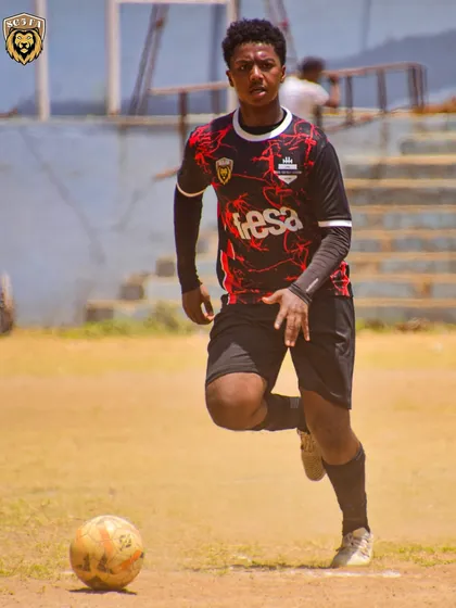 An SG5 player on the run, showcasing his speed and control during the U17 match.
