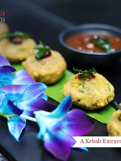 Beautifully plated kebabs garnished with fresh herbs and edible flowers. This image showcases our attention to presentation, making even simple appetizers look exquisite.