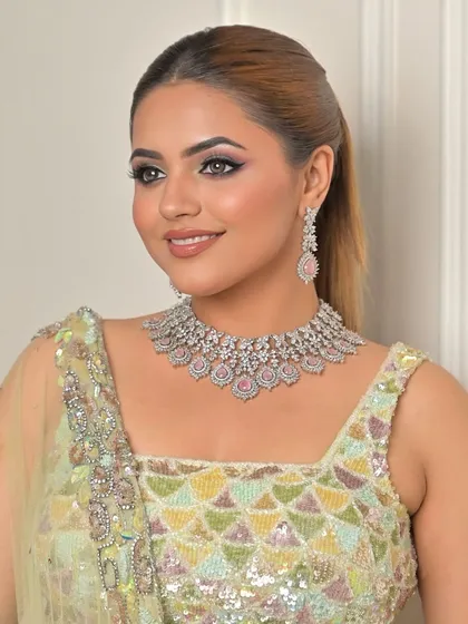 Channeling timeless beauty with a touch of contemporary minty magic. This look is fresh, modern, and perfect for a stylish event.