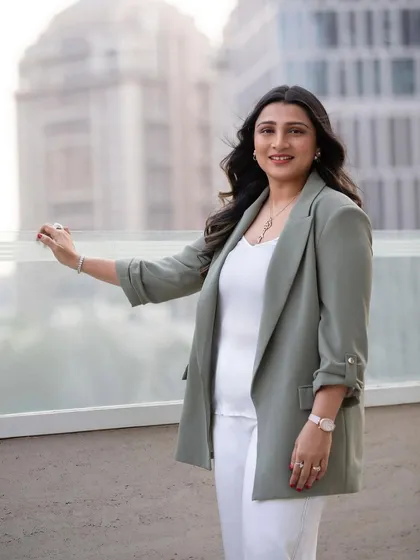 A confident smile against an urban backdrop. This environmental business portrait feels dynamic and modern, perfect for a founder or CXO making their mark.