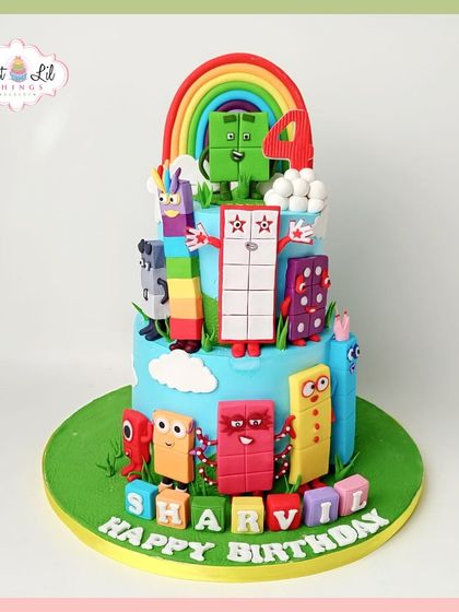 Learning is fun with this colorful Numberblocks cake. This two-tiered creation brings the educational characters to life, making it perfect for a 4th birthday.