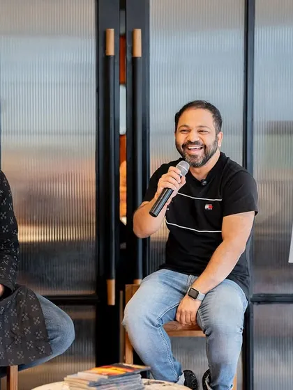 A candid shot of author Ashish Godya and the host, showing the relaxed and friendly atmosphere we cultivate at our book launches.