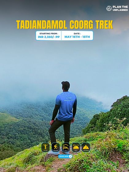 A trekker looks out over the misty mountains on the Tadiandol trek.
