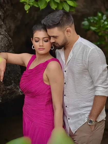 An intimate moment from the pre-wedding shoot. The makeup is kept fresh and minimal to suit the tropical location and casual outfits.