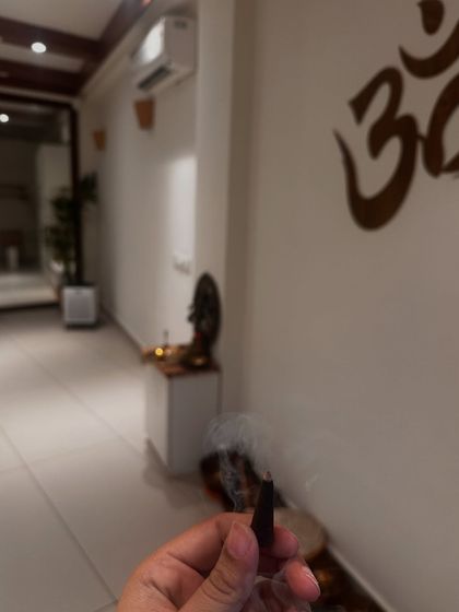 The simple ritual of lighting incense to cleanse the space before a class. This act sets the tone for our practice, creating a sacred and peaceful environment from the moment you walk in.