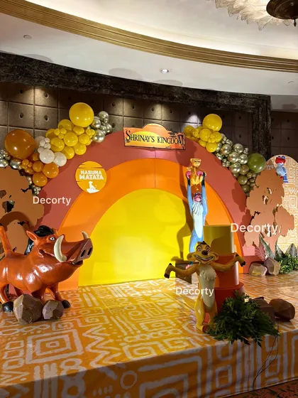 A beautiful composition of the stage, with Pumbaa, Timon, and Rafiki figures creating a lively scene.