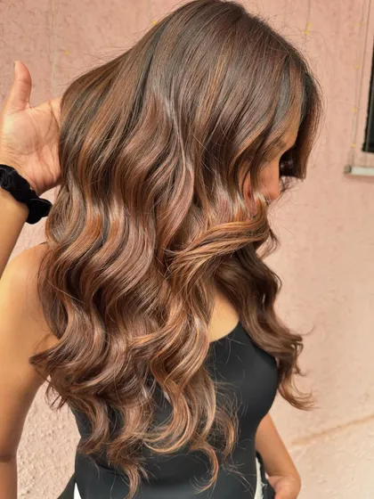 A side view of this brunette goddess wedding hair. The non-bleach color is rich and glossy, perfect for her special day.