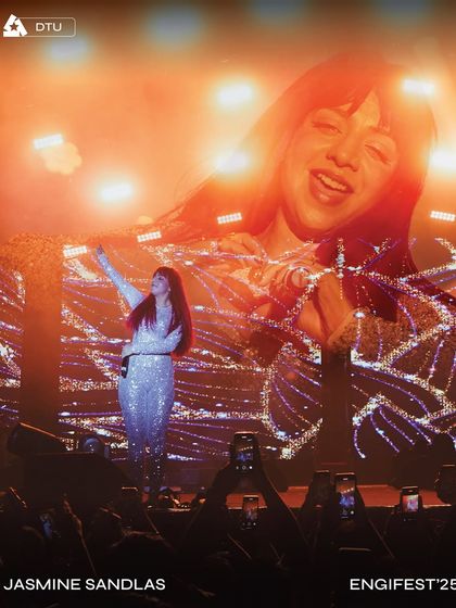 Jasmine Sandlas captivates the audience at Engifest '25, DTU, with her image projected on the massive LED screen behind her.