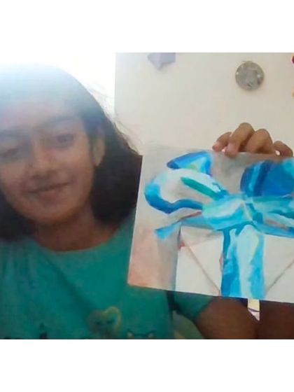 A beautifully rendered gift box, created by a student who discovered the image as she colored, a magical moment of creative discovery.