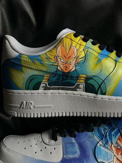 A close-up of a custom Dragon Ball Z themed Nike Air Force 1, featuring Super Saiyan Vegeta.