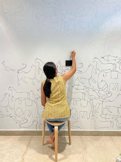 The process of creating the whimsical animal doodle wall for a nursery. It all starts with a single line, which then multiplies into a playful herd of imaginary creatures.
